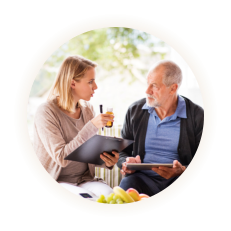 caregiver discussing about the medicine to elderly man